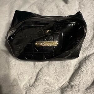 Betsy Johnson cosmetic bag, black patent leather